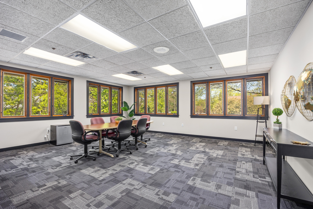 Conference room with large windows and a central table at Parkview Counseling
