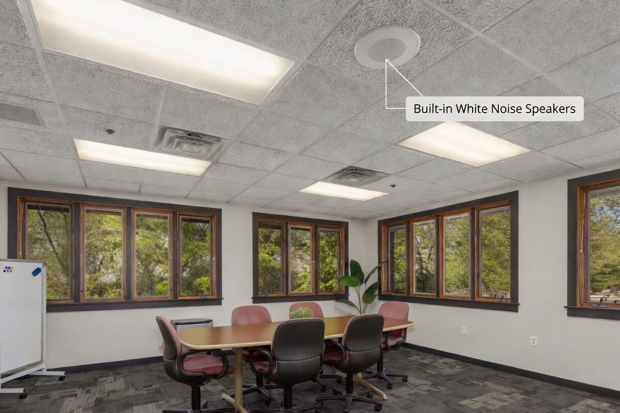 Conference room ceiling with built-in white noise speaker
